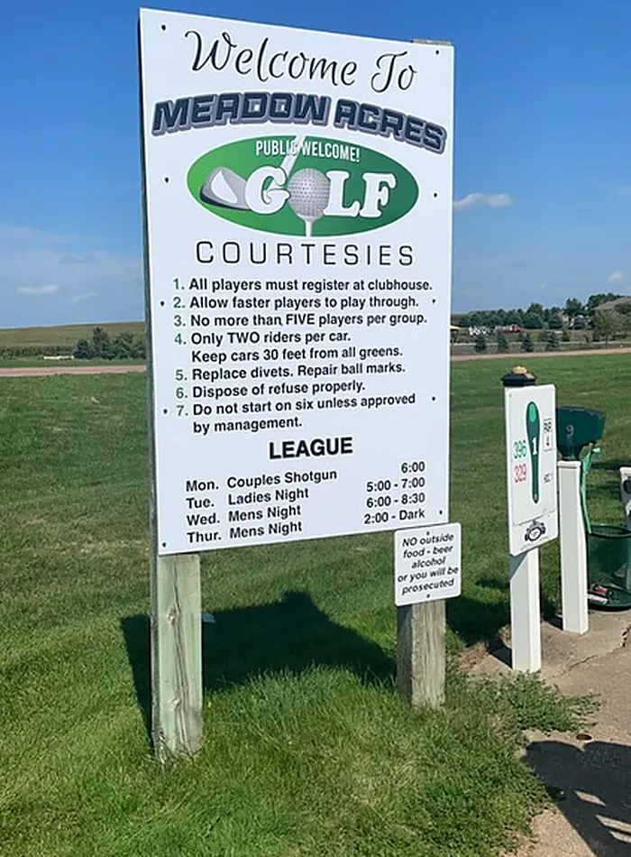 The welcome sign at the first tee listing course courtesies and league nights